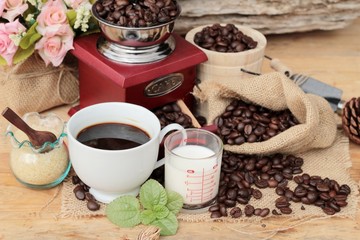 Fototapeta na wymiar Coffee grinder with coffee beans and cup espresso.