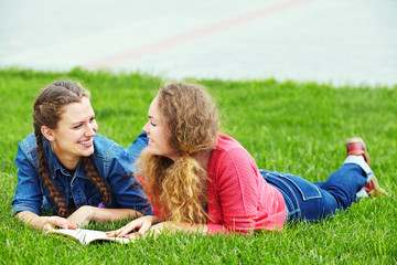 Fototapeta premium two girlfriends reading a book