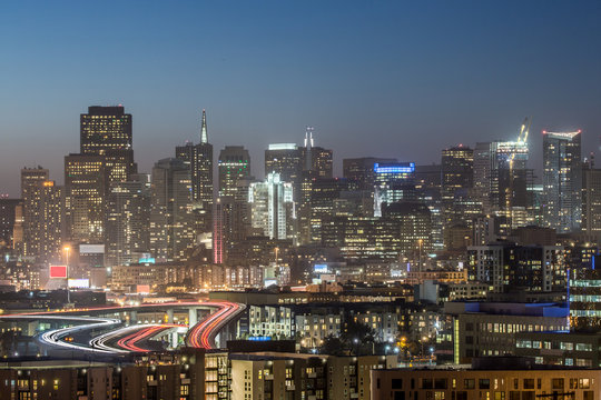Highway to San Francisco. High angle shot of San Francisco downtown and highway I-280, dusk from Potrero Hill.
