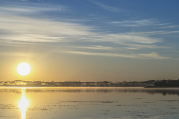 Sun on lake in the morning