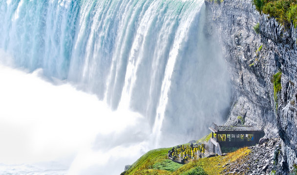 Some Tourists visiting underneath Niagara Falls