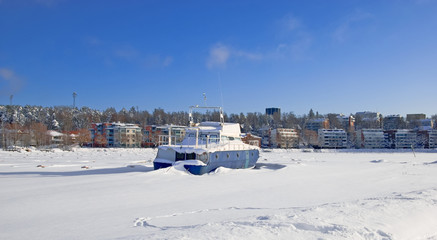 Lappeenranta. Finland. Winter landscape with boat in Lappeenranta Harbor on Saimaa Lake