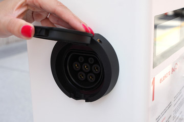 closeup look of power socket of electric car charger.