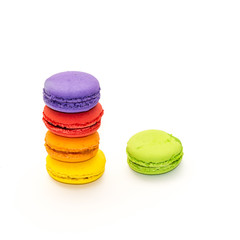 Testy french colorful macarons in a row, isolated on white