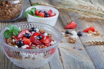 Dessert with fresh berries, cottage  cheese, granola and berries