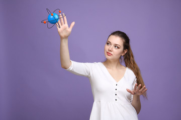 Woman scientist with atom model, research concept