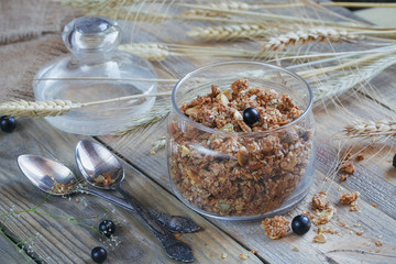Granola, berries and ears of wheat and oats