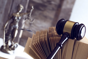 Law concept. Judge gavel, statue and book