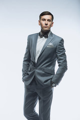 Fototapeta premium Portrait of a elegant handsome business man on white background