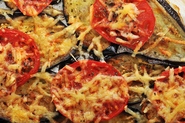 eggplant with tomatoes and chees in the dish for cooking