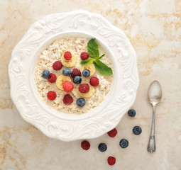 healthy Breakfast - cereal with blueberries, raspberries and ban