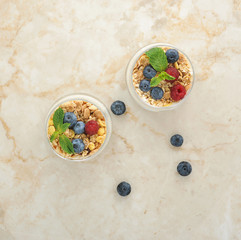 Obraz na płótnie Canvas healthy desert - cereal with blueberries, raspberries and banana