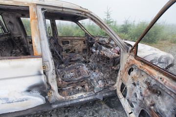 Looking into a burnt out car interior