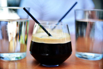 Freddo instant coffee on ice cubes Greek summer drink