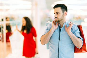 Frustrated man waiting for spouse