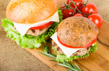 Wheat and rye burgers on wood board