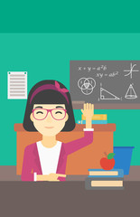 Student raising hand in class for an answer.