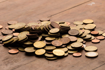 Euro coins in wood background