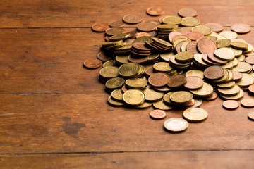 Euro coins in wood background