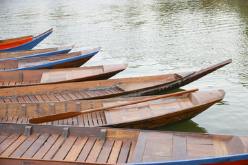 Stock Photo:.Old wooden row boat on water