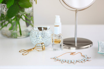 Cosmetic set on light dressing table