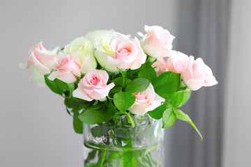 Beautiful bouquet of roses on blurred background