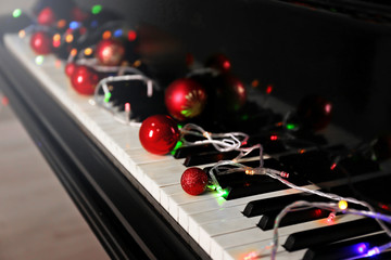 Christmas decoration on piano keys, closeup
