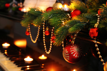 Piano keys with Christmas decorations, closeup