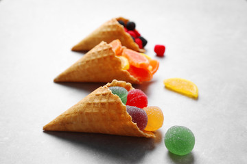 Dessert in ice cream cone on light background