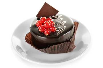 Chocolate cake with fresh currant on light background