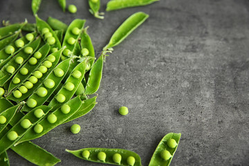 Fresh green peas on table