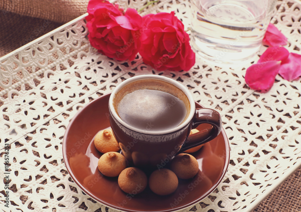 Poster cup of coffee with flower and cookies on tray