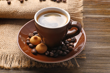 Cup of coffee on sackcloth