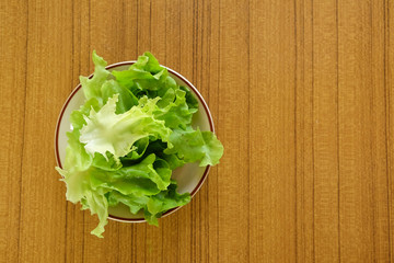 Green lettuce on the wooden table