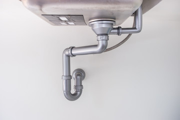 Dirty water pipe in kitchen.