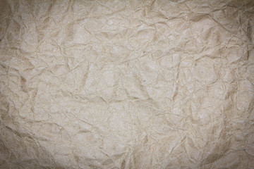 Recycled crumpled brown paper texture or paper background for design with copy space for text or image.