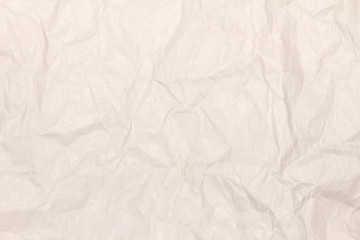 Crumpled light brown paper texture or paper background for design with copy space for text or image.