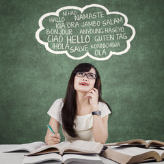 Clever female learner studying foreign language