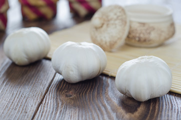 garlic bulb on the wooden table. vintage background