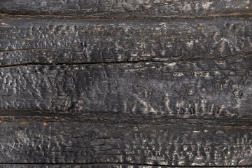 Charred black wooden wall