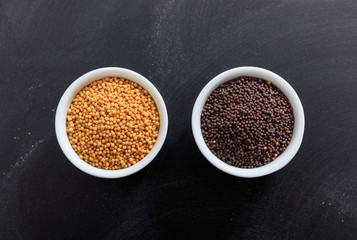 Mustard seeds in porcelain bowls