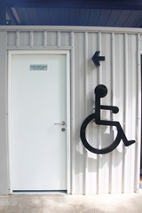 Stock Photo - Label sign of cripple on container wall