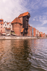 Naklejka premium Medieval crane (Zuraw) in Gdansk, Poland, seen from the boat