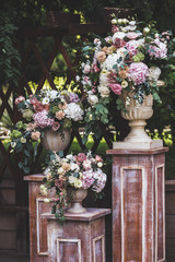 Fototapeta na wymiar Сream-colored wedding ceremony with fresh flowers