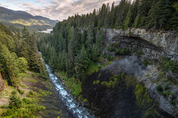HDR photography of a beautiful river running down a canyon during a cloudy sunset. Taken in Brandywine Falls, near Whistler, BC, Canada. © edb3_16