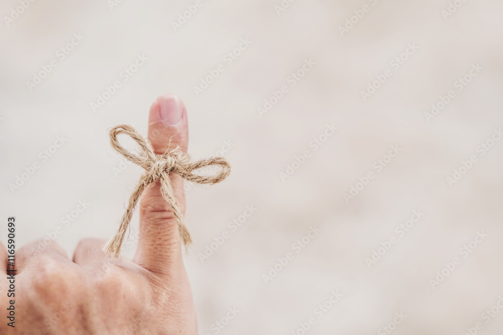 Wall mural String tired around finger, selective focus, soft focus vintage tone