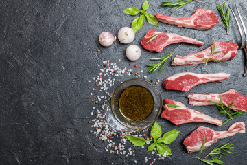 Raw lamb chops with salt, pepper, rosemary 