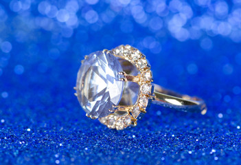 Jewellery ring against blue background