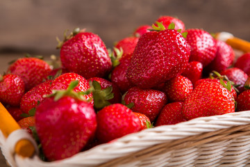 Pile of ripe strawberries. Berries in a basket. Ingredient of fruit pie. Fresh from the garden.