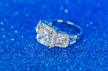 Jewellery ring against blue background